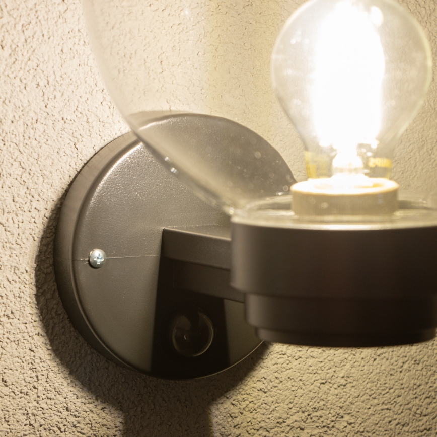 BRILAGI - Уличный настенный светильник HARBOR с датчиком движения 1xE27/40W/230V IP33 черный/прозрачный