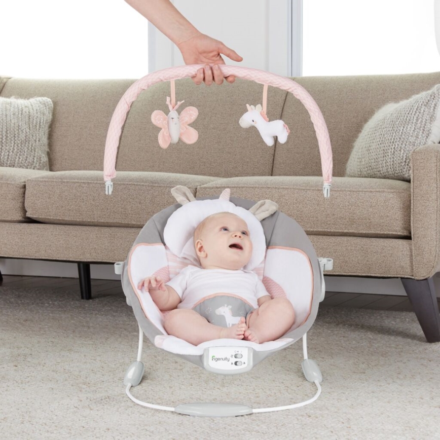 Ingenuity - Детское вибрирующее кресло-шезлонг с музыкой FLORA THE UNICORN 3xC