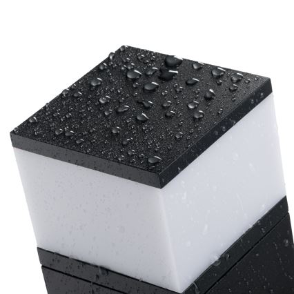 Вуличний настінний світильник з розеткою DASTEN 1xG9/11W/230V IP44 чорний