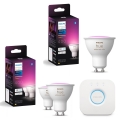 Komplekt iz 3 zatemnjuvanykh LED RGBW-lamp Philips Hue WHITE AND COLOR AMBIANCE GU10/4,2W/230V 2000–6500K + Hue Bridge