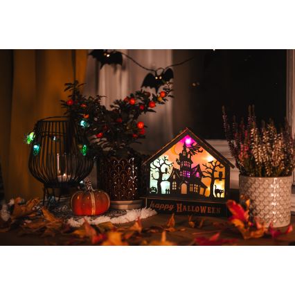 LED Прикраса HALLOWEEN LED/2xAA/кольоровий будинок з привидами