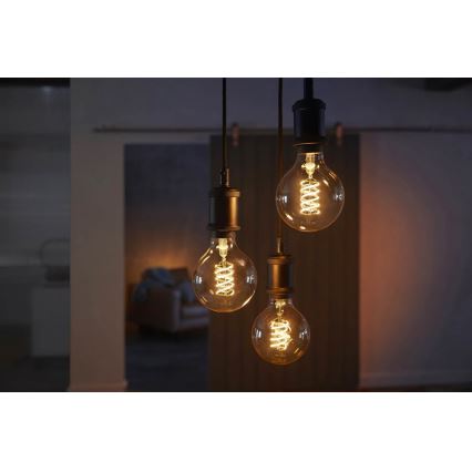 Светодиодная лампочка с регулированием яркости Philips Hue WHITE FILAMENT G93 E27/7W/230V 2100K