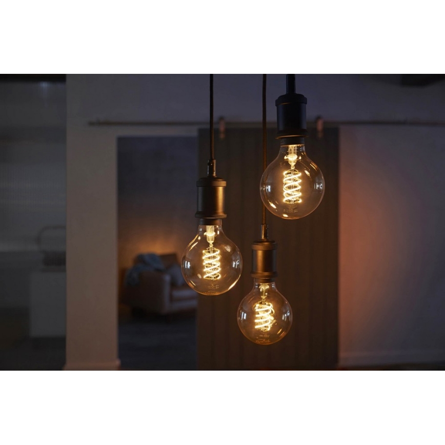 Светодиодная лампочка с регулированием яркости Philips Hue WHITE FILAMENT G93 E27/7W/230V 2100K