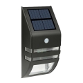 Светодиодный настенный светильник на солнечной батарее с датчиком LED/3,7V IP44 черный