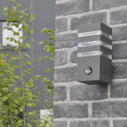 Настенный уличный светильник с датчиком TEKSAS 1xE27/12W/230V IP44 антрацит